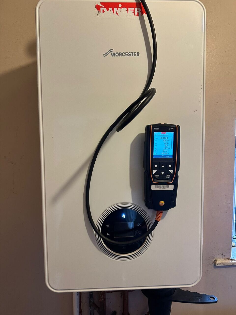 Worcester LPG boiler undergoing professional flue gas combustion analysis (testo 310) for safety compliance