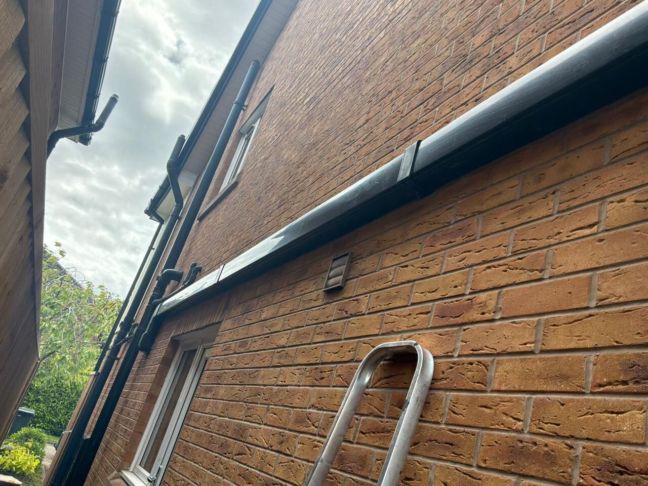 Pipework beautifully concealed externally on brick wall – clean, tidy and protected finish, Preston